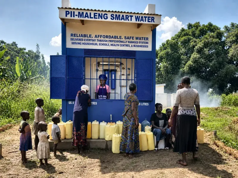 Customers queueing with jerrycans at a Pii-Maleng kiosk